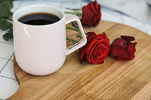 coffee mug, red roses, bed, sheets, wood board