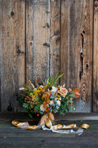 wedding bouquet against a wood background 