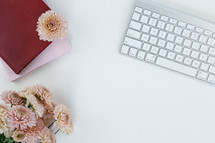 book, journal, mums, computer keyboard on a white background