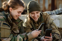AI Image. Two young female soldiers having rest in military yard using smartphone