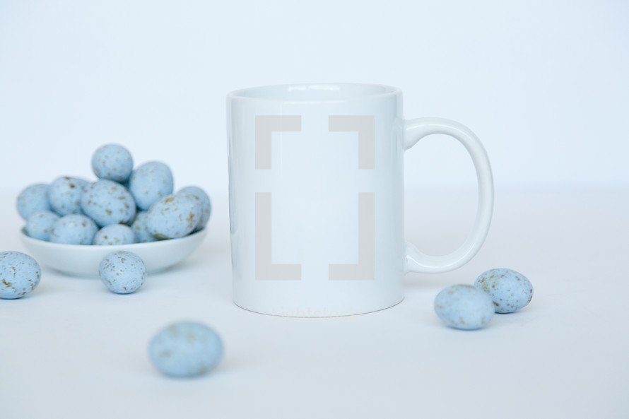 coffee mug and speckled blue eggs 