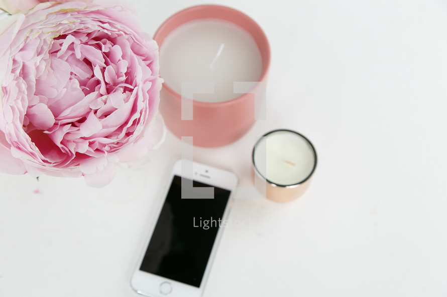 pink peony, candles, and iPhone 