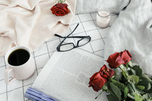 pages, book, reading in bed, sweater, roses, sheets, linens, bed, bedding, bedspread, planner, journal, pencil, reading glasses, candle, coffee mug, grid