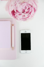 iPhone, pen, journal, and pink peony on a white background 
