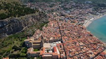 Aerial shot drone flies from north to south over Cefalu, Sicily, Italy