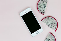 iPhone and dragon fruit slices 
