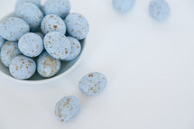 speckled blue eggs in a bowl 