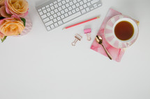 tea cup, computer keyboard, pink, peach, roses, clips, spoon, pencil, desk, white background, spring 