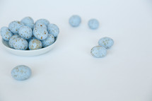 speckled blue eggs in a bowl 
