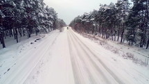 Winter Traveling Car. Road Covered With Snow