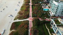 Overhead drone shot of Miami Beach boardwalk and foot path in Miami Beach Florida