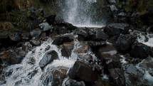 Cascading Waterfall In Cayambe Coca National Park In Papallacta, Ecuador - tilt up	