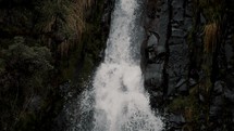 Water Cascading Down On Rocks In A Mountain Forest - Cayambe Coca National Park In Papallacta, Ecuador - slow motion