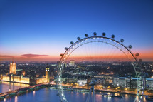 Elevated view of the London Eye and the Houses of Parliament at sunset, London. England.- for editorial use only 