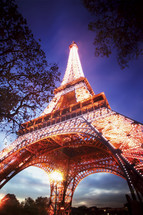 Low angle view of the Eiffel Tower at dusk, Paris. France.- for editorial use only.