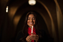 Parishioner holding candles at a Christmas Eve Service 