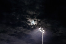 moon through clouds - ball field lights