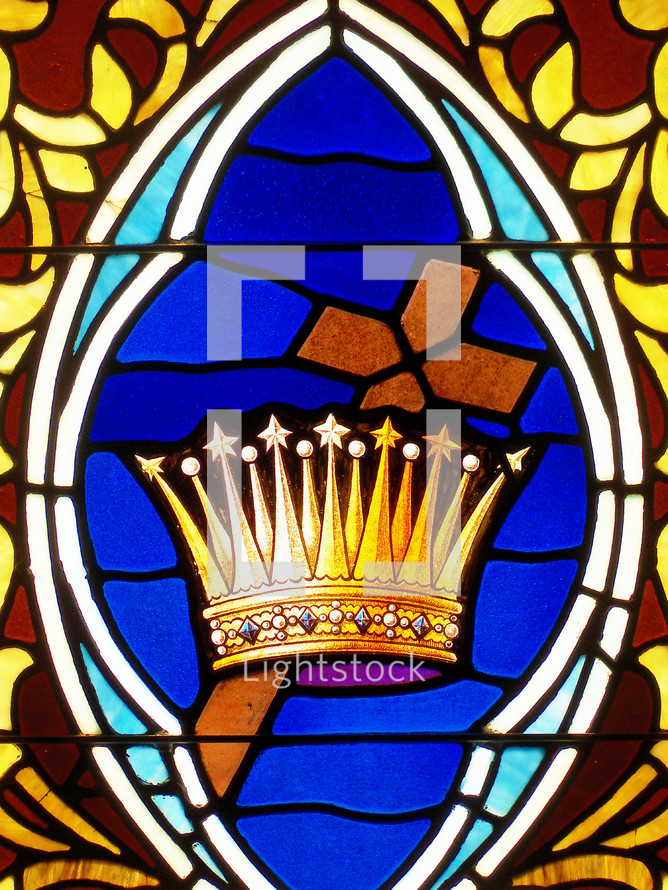 The Cross and the Crown of Jesus Stained Glass window against a blue backdrop. Beautiful stained glass window displaying the Crown of Christ and the old rugged wooden Cross. 