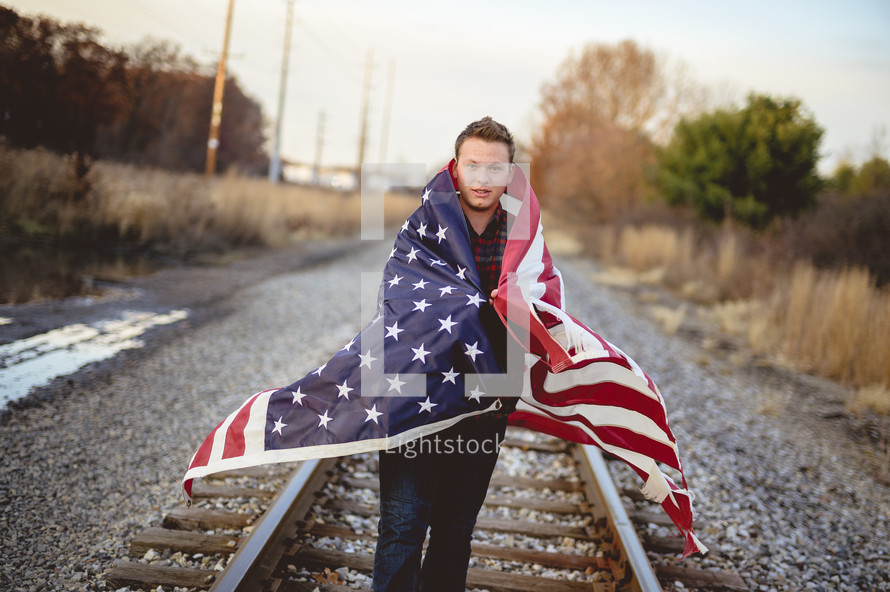 man wrapped in an American flag 