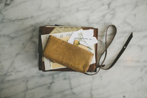 change purse, Bible, journal, dried flower, paper 