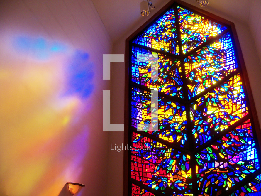 The window to Heaven - a large stained glass window lets light in to fill a prayer chapel with light and warmth as people come in to pray. 