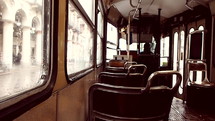 empty shaky vintage tram moving in a rainy day