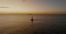 Aerial Drone shot of Boat At Sunset On The Sea Horizon In Guanacaste, Costa Rica