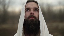 Religious, Christian man with beard or Jesus Christ, bible prophet looks to heaven in prayer and worship.