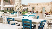 Table of a Sicily restaurant in Marzamemi city outdoor square