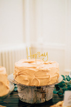 Cake on Wood Stand with Hooray Candle