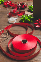spool of red ribbon, ribbon, bows, ribbon, gift wrapped, tape, red, green