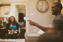 man pointing in a small group Bible study