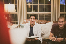 men sitting on a couch at a bible study