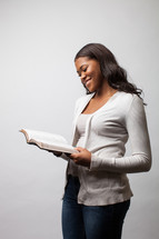 A woman reading a Bible. 