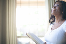 Woman looking up to God in praise