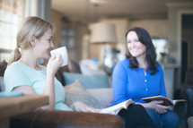 women sitting on a couch at a bible study