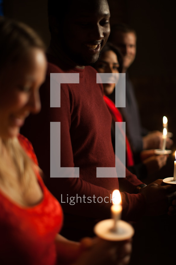 Parishioners holding candles at a Christmas Eve Service 