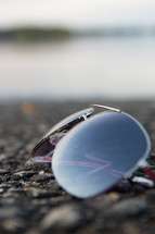 sunglasses on pavement