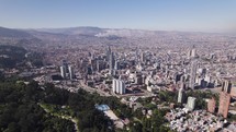 Aerial view approaching the downtown of Bogota city, sunny day in Colombia