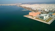 Drone shot of the coast of Greece and the Thessaloniki Concert Hall