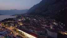 Night aerial view of historical city of Kotor in Montenegro, drone flyover