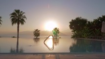 Swimming pool on resort, view against the sunset
