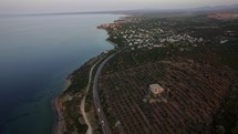 Flying over the sea and shoreline of Trikorfo Beach, Greece