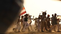 drums, running, celebration, men, tribesmen, outdoors, colorful, flags, dust