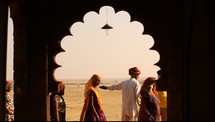 view, women, men, standing, desert, temple, window, India 
