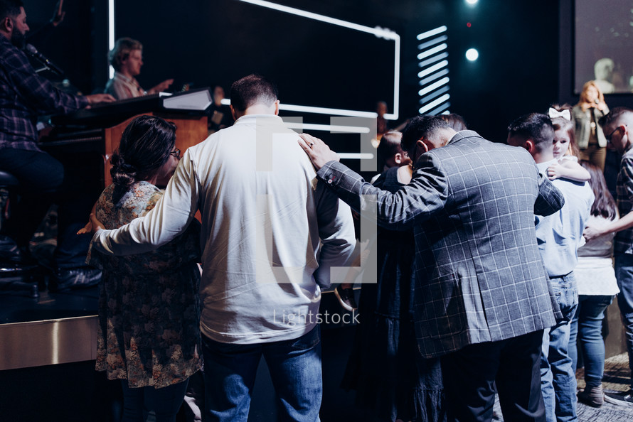 group prayer during a worship service 