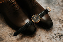 watch and dress shoes 