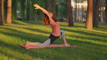 Woman stretching to warm up for exercise in a park
