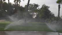Slow motion of working irrigation sprinklers 