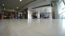 Timelapse of people traffic in entry hall of airport